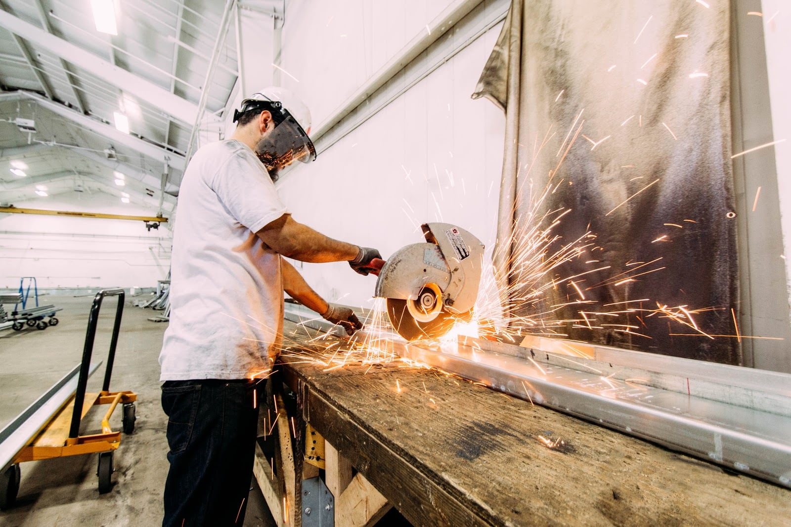 Industrial worker fabricating at workbench